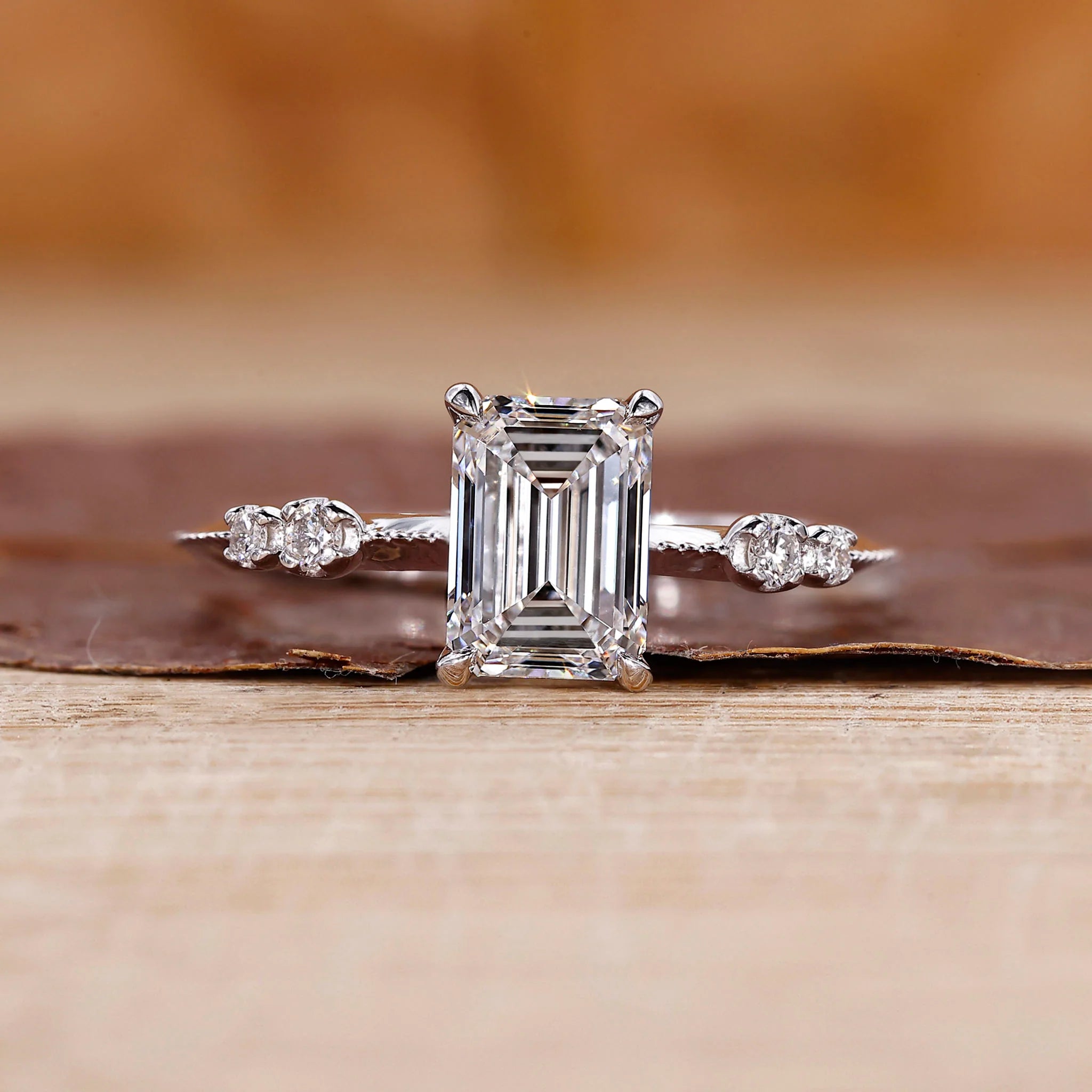 White Gold Emerald Ring With Knife Edge Shank Band