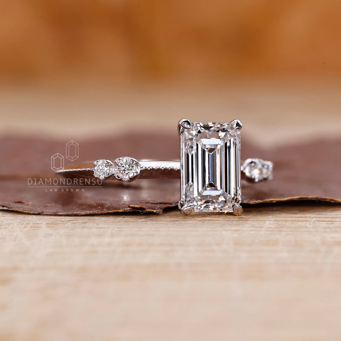 White Gold Emerald Ring With Knife Edge Shank Band