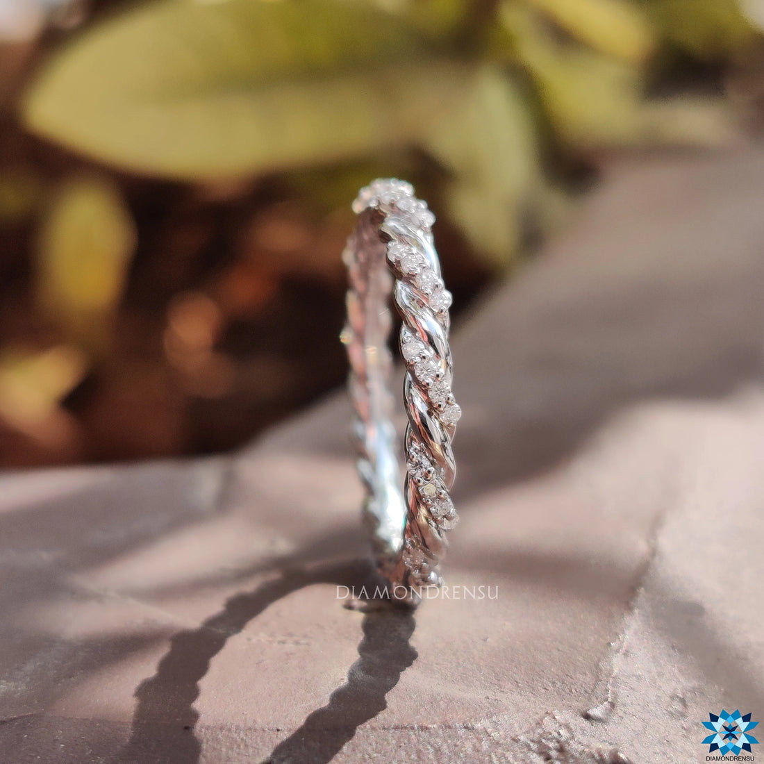 Contemporary Twisted Pave Shank Moissanite Eternity Wedding Band