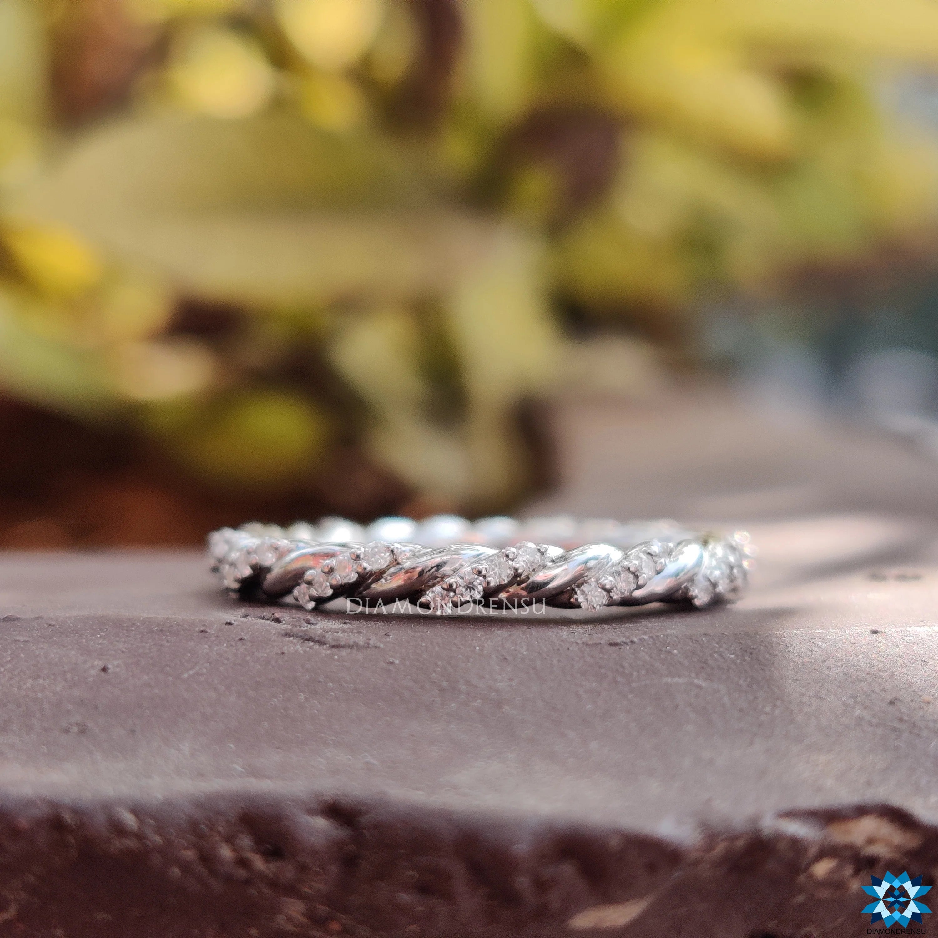 Contemporary Twisted Pave Shank Moissanite Eternity Wedding Band