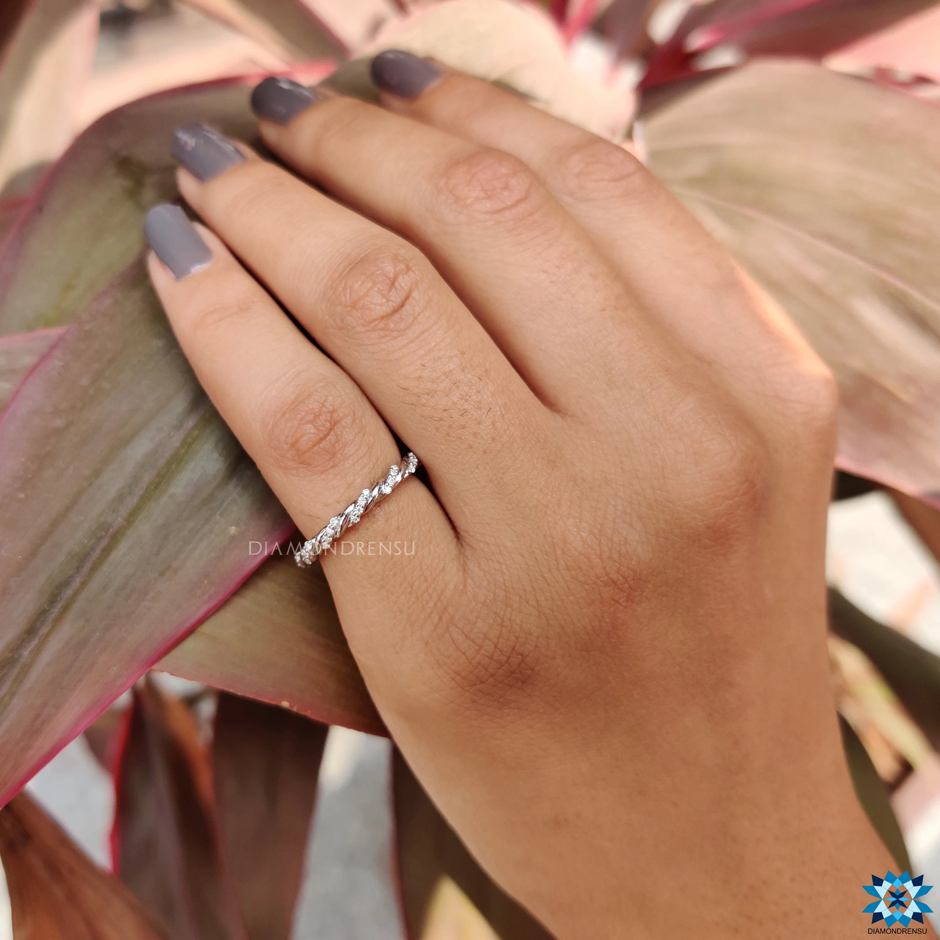 Contemporary Twisted Pave Shank Moissanite Eternity Wedding Band