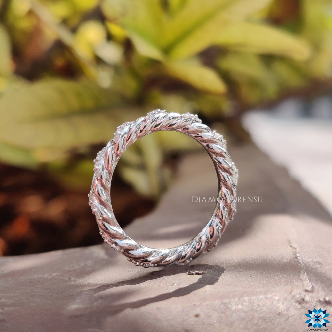 Contemporary Twisted Pave Shank Moissanite Eternity Wedding Band